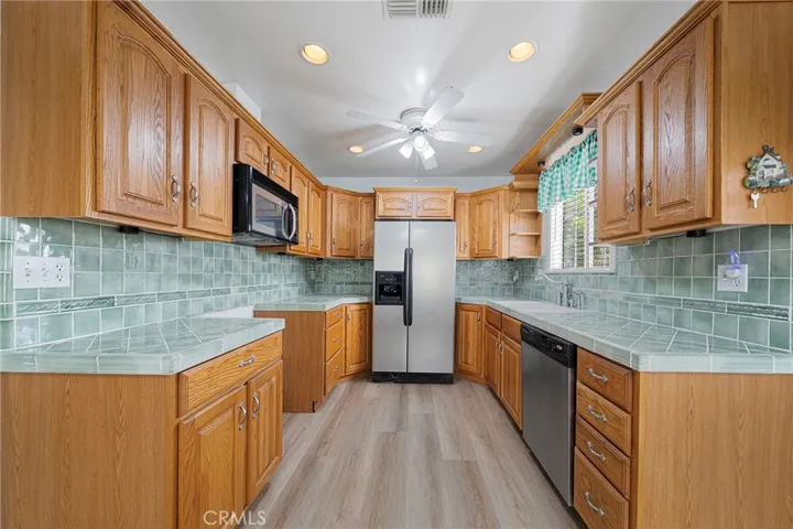 Spacious kitchen with lots of lighting.
