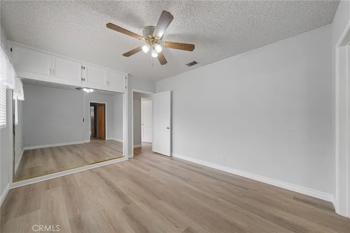 Bedroom #3, new paint and flooring, mirrored closet doors and a ceiling​​‌​​​​‌​​‌‌​​‌​​​‌‌​​​‌​​‌‌​​‌‌​​‌‌​​​​ fan.
