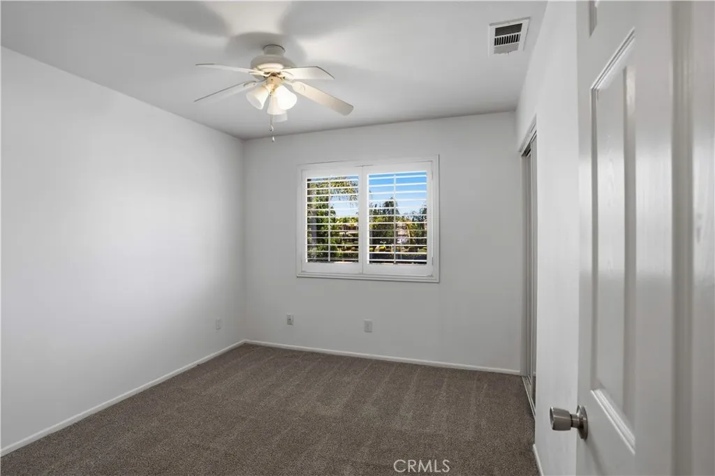 Second bedroom to the left of the stairs
