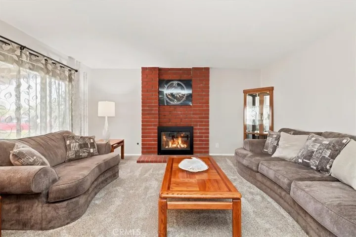 Living Room (fireplace virtually lit)