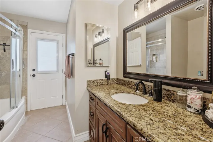 Hall bathroom with convenient backyard access.