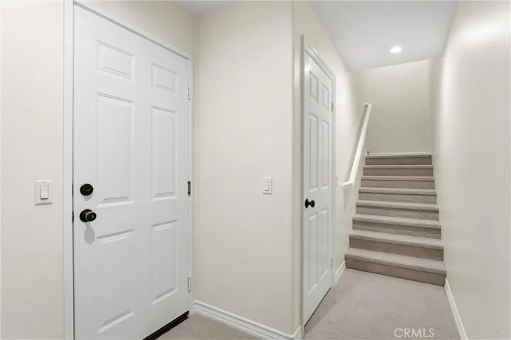 Stairs have brand new carpets leading to the main living area