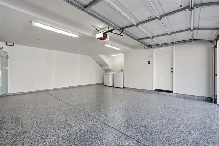 Garage with New Epoxy Flooring. Washer and Dryer are included.