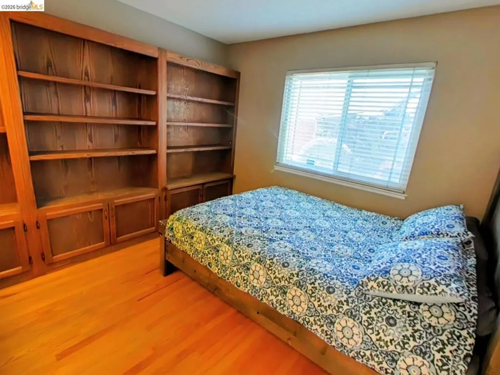 Built-in wood cabinetry with open shelving and lower storage
