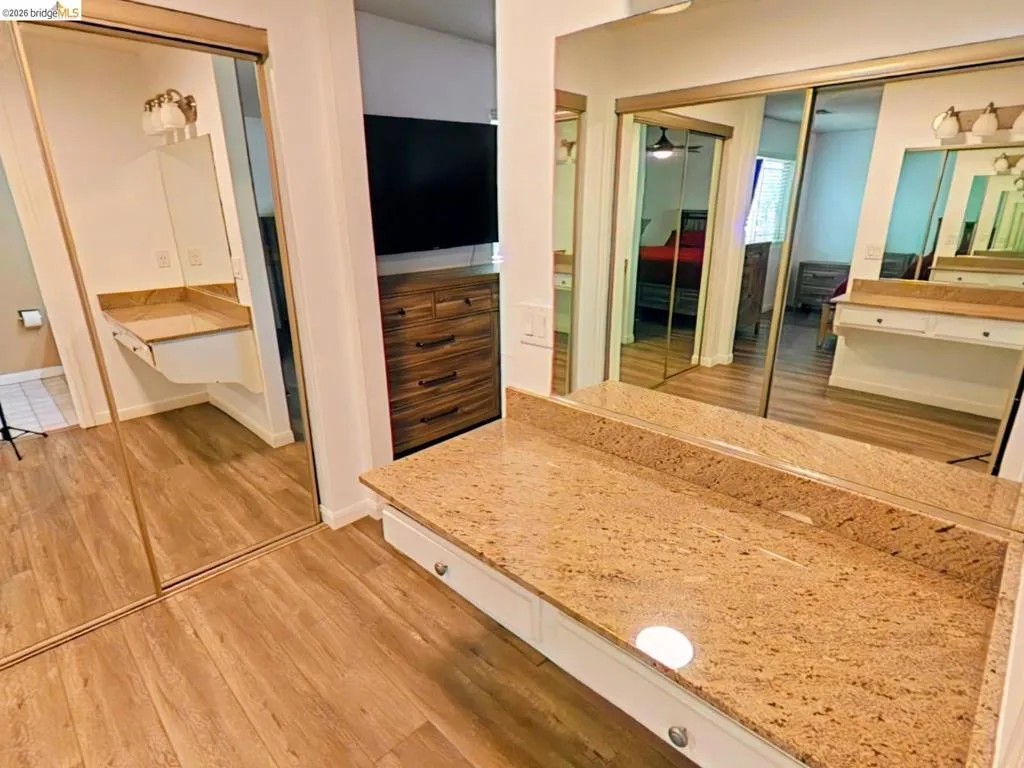 Expansive counter space featuring a durable stone-finish countertop with built-in storage