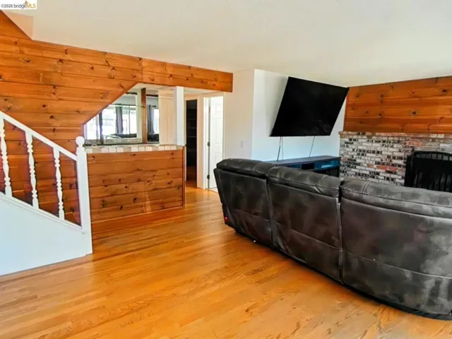 Hardwood flooring throughout the living space