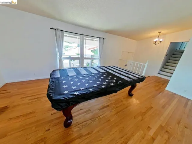 Bright interior space featuring wood-finish flooring