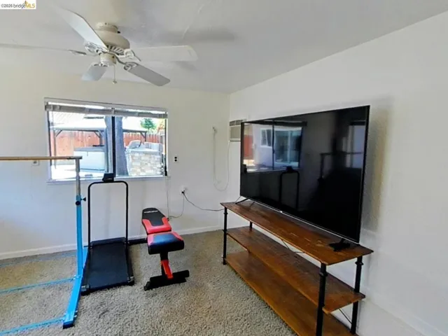 Bright room with neutral wall paint and carpeting