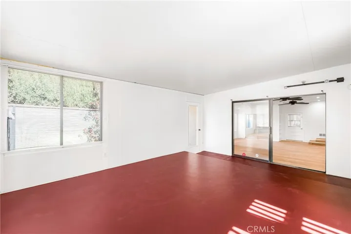 Sunroom has a closet and an exit to the backyard