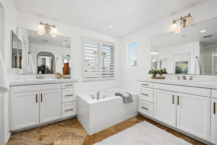 Primary bathroom with separate vanities