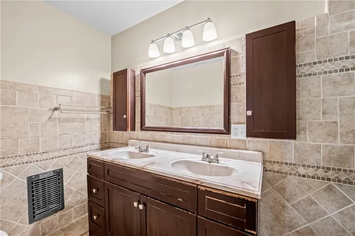 Bathroom #2 – Dual sinks provide added convenience for roommates.