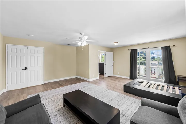 Bedroom #6 – Large walk-in closet complements the spacious upstairs bedroom with balcony access.