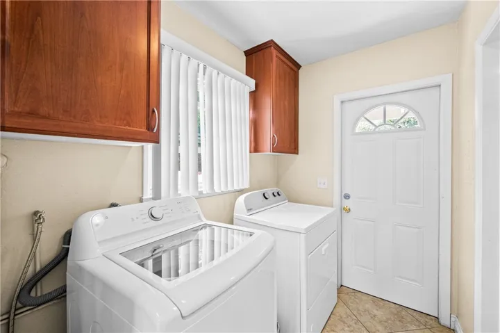 Laundry room with washer and dryer included.