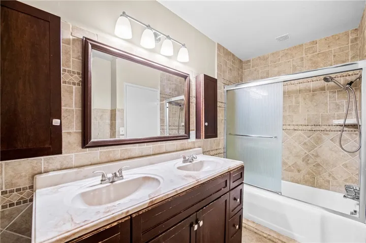 Spacious primary bath with oversized vanity and shower.