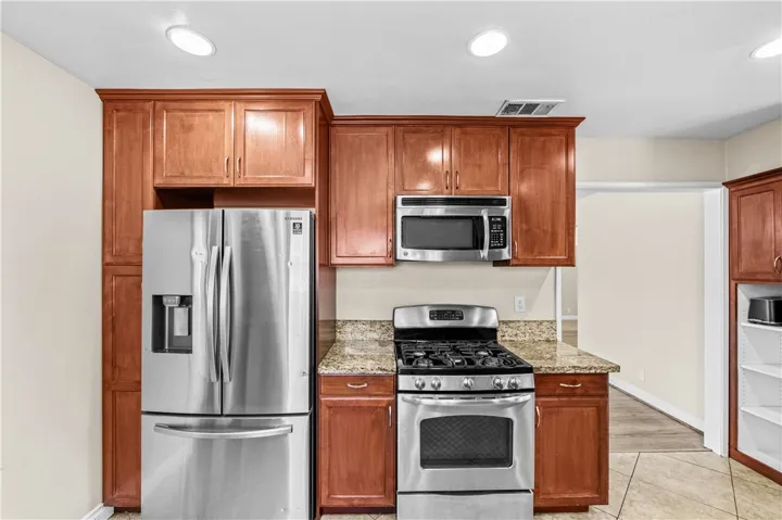 Additional kitchen view showcasing ample workspace and storage.