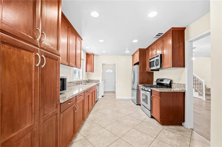 Spacious kitchen with abundant cabinetry and generous counter space.