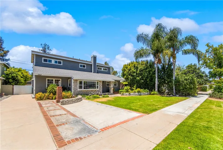 Large front yard with attractive curb appeal and ample parking.