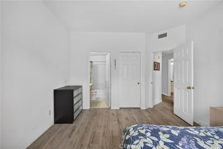 Primary Bedroom with a bathroom and walk-in closet!