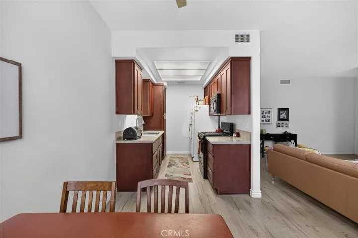 Dining area, kitchen and part of the living room.
