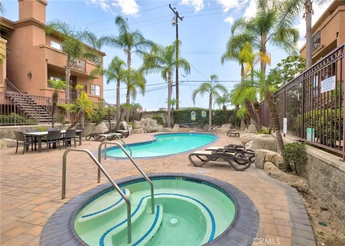 For your enjoyment, a pool and spa in an enclosed setting.