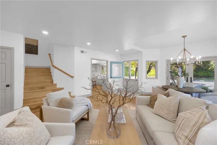 Living Room with Kitchen and Stairway background
