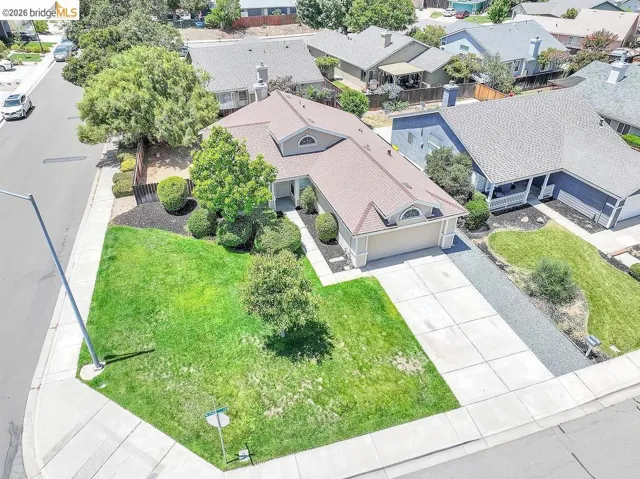 Contemporary single-story residence with a concrete driveway and two-car garage
