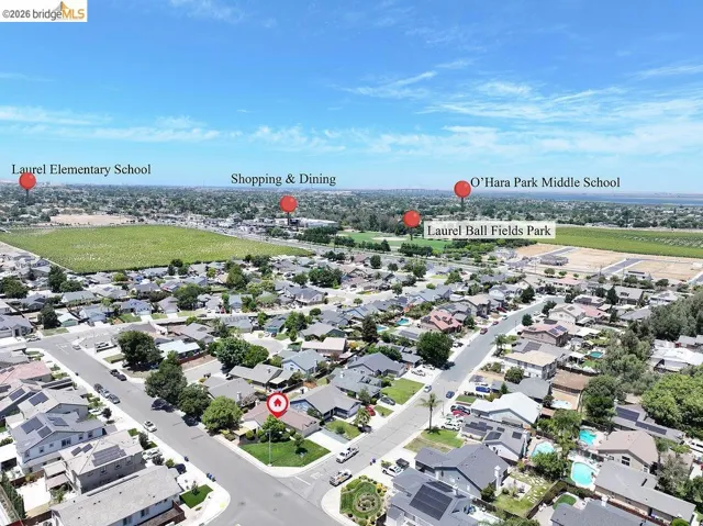 Aerial overview showcasing a residential neighborhood with surrounding infrastructure