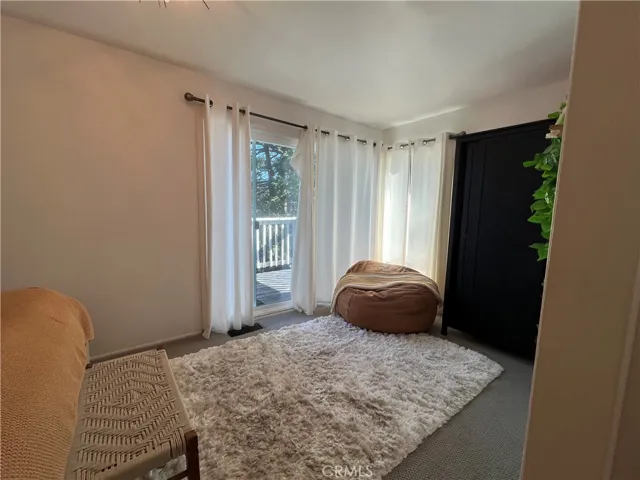 Upstairs bedroom has it's own patio door