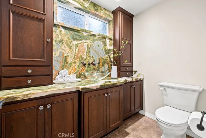 Downstairs Primary Bedroom with Onyx Counter Tops and Backsplash