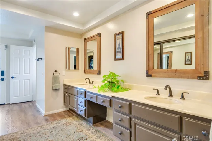 Primary bathroom with door off back to the pool and spa