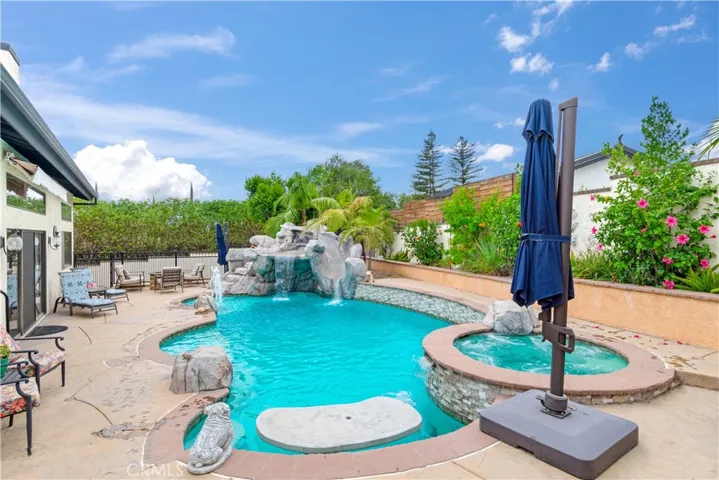 Rock water fall pool with slide and table. Baja shelf
