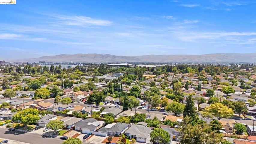 Expansive aerial perspective showcasing a residential neighborhood with numerous homes