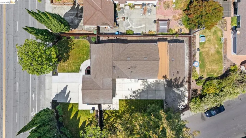 Aerial perspective showcasing the property's roofline and surrounding landscaping