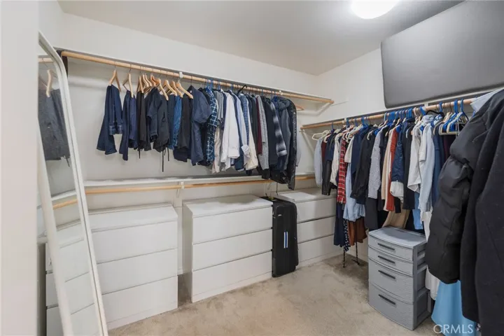 Spacious walk-in closet in primary bedroom.
