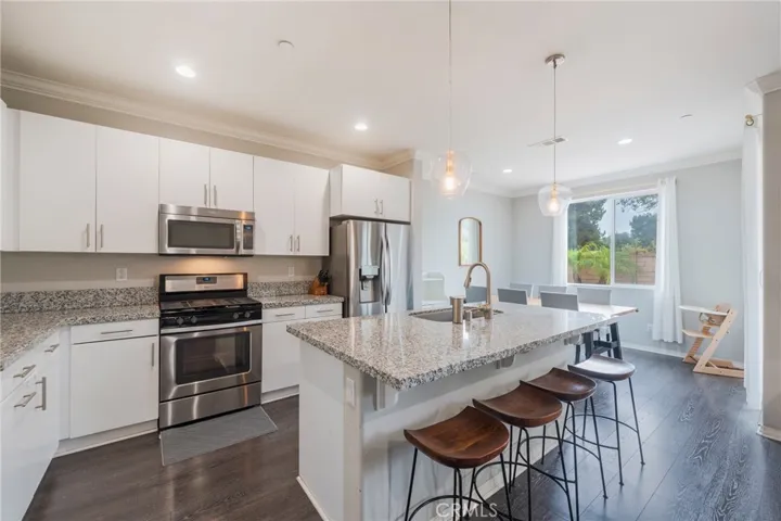 Kitchen opens to the dining area.