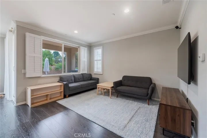 Living room with large windows and high ceilings.