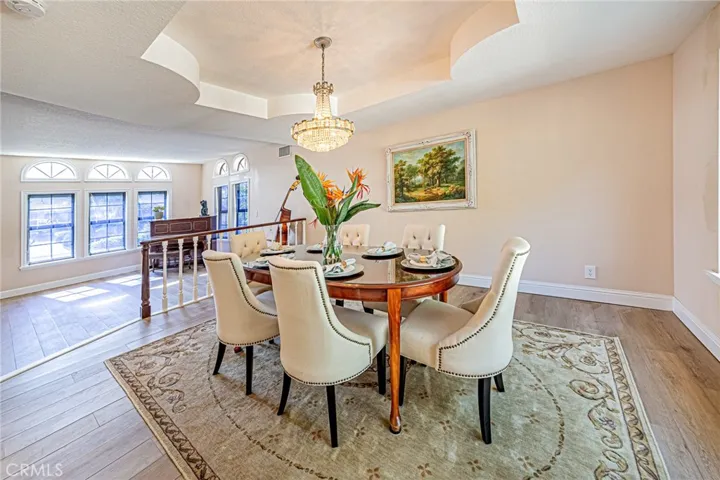 Sophisticated dining room featuring picturesque views of the backyard
