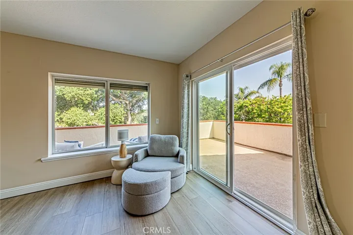 Private primary suite with a spacious balcony offering sweeping mountain and nature views