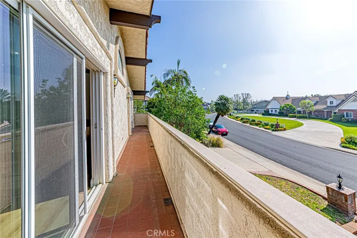 Bonus room with sliding glass doors opening to a private balcony