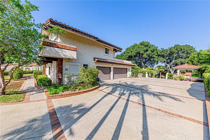 3-car garage with an extended driveway offering abundant parking for RVs, recreational vehicles, and guests