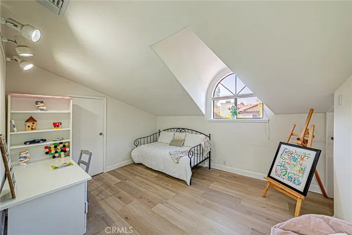 Cozy fourth bedroom featuring European-style design