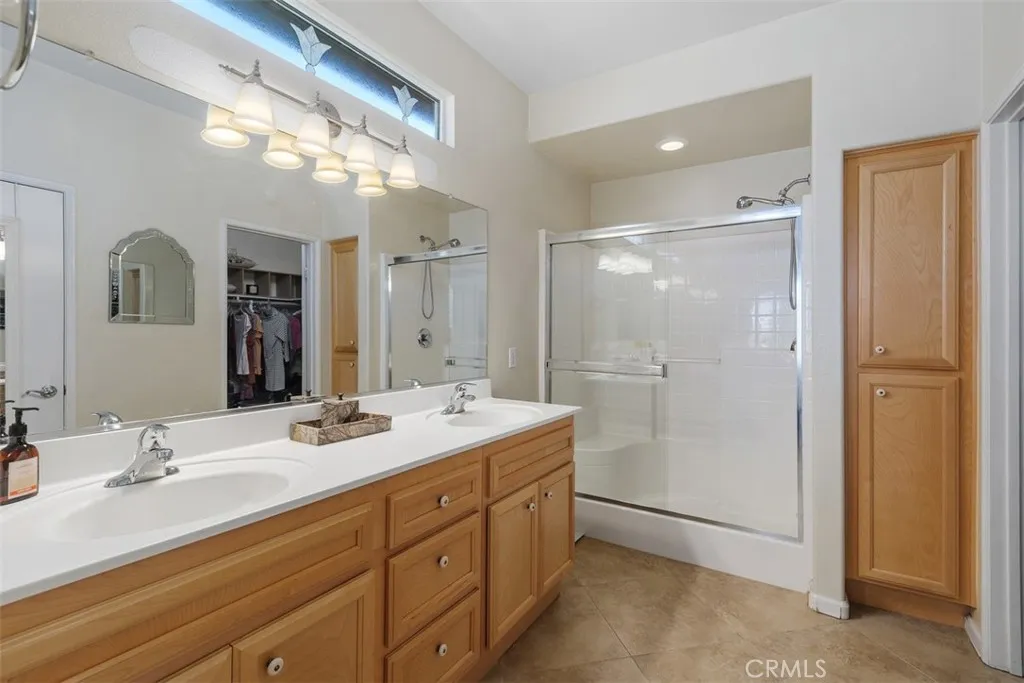 Primary bath with walk in shower and walk in closet