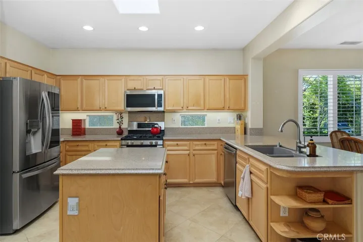 Lots of kitchen cabinets and a panty.