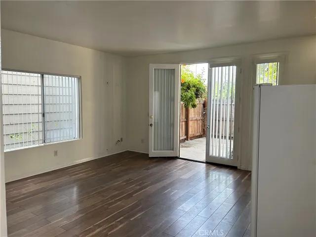 Living space open to kitchenette and front fenced patio