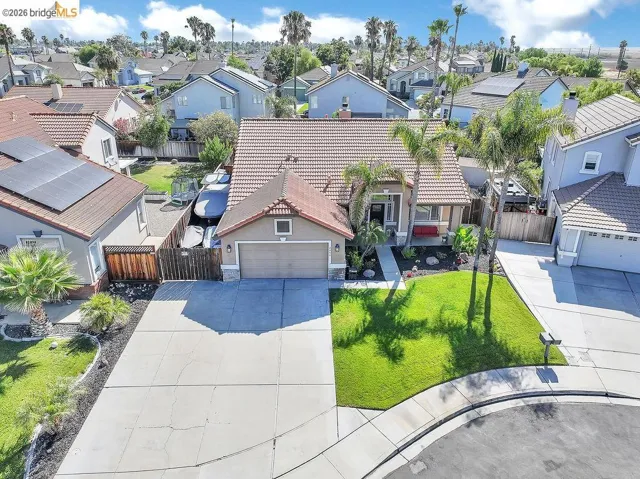 Single-story residence featuring a concrete tile roof and an attached two-car garage