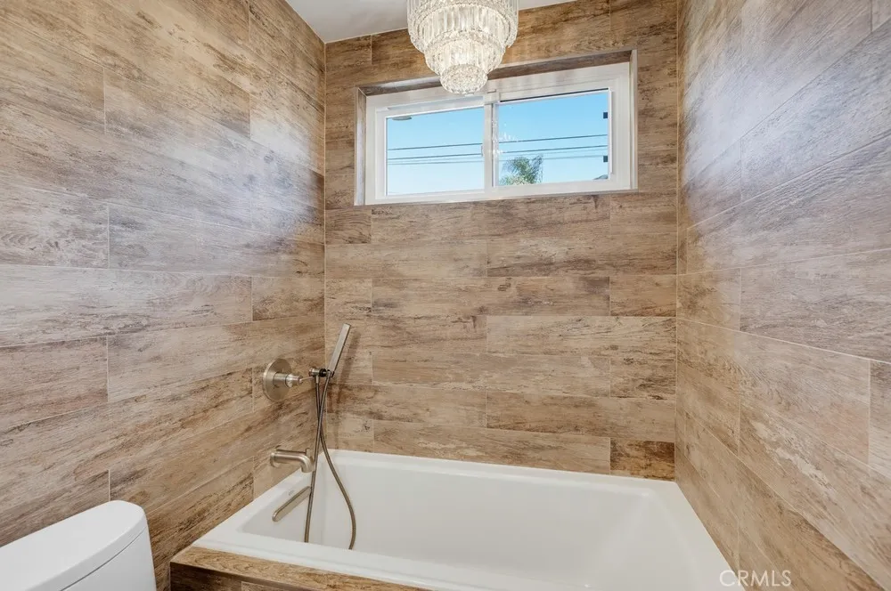 downstairs full bath with soaking tub and hand held shower wand (can be mounted higher)