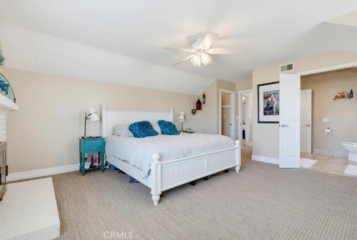 Spacious Primary Suite with walk-in closet and fireplace