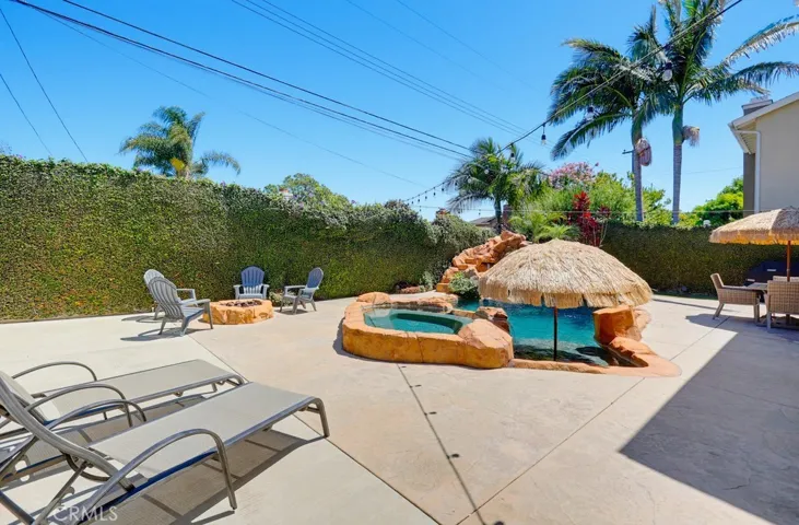 Amazing entertaining yard , Pool,spa,firepit grotto and rock slide and water feature