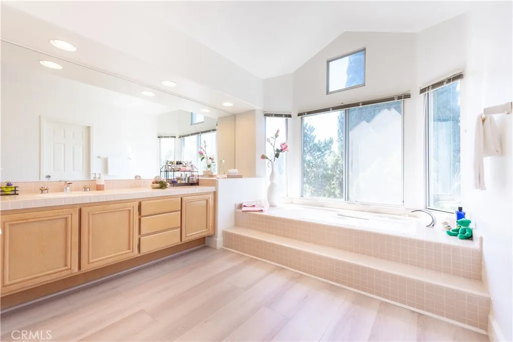 Primary bathroom-- his & her walk-in closets, soaking tub