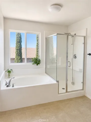 Master Bathroom Shower/Bathtub (Picture is AI Enhanced)